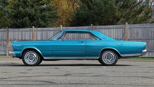 Left side view of a metallic aqua 1966 Ford Galaxie 7-Litre two-door hardtop