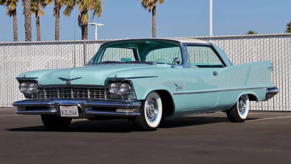 Left front 3q view of a Horizon Blue 1957 Imperial Crown four-door hardtop with a white roof