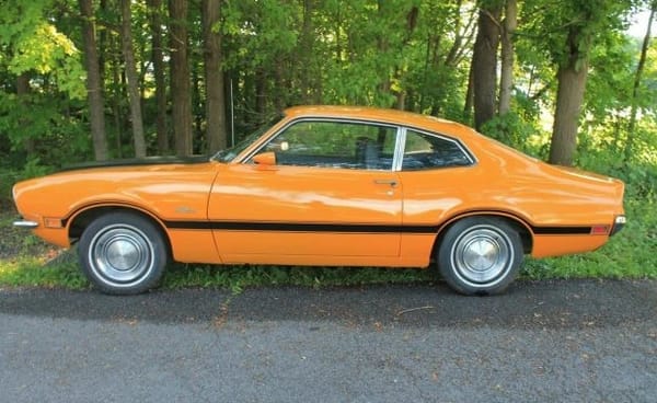 Left side view of a Grabber Orange 1970 Ford Mustang Grabber