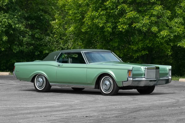 Two Dozen Green Cars And Trucks To Mark The Start of Spring 17 Front 3q view of a medium green 1971 Lincoln Continental Mark III with a green vinyl top