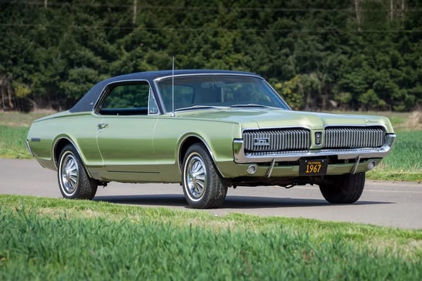Right front 3q view of a Lime Frost Metallic 1967 Mercury Cougar XR-7 with black vinyl top