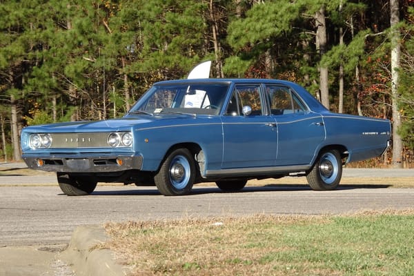 Left front 3q view of a blue 1968 Dodge Coronet 440 four-door sedan with dog dish hubcaps