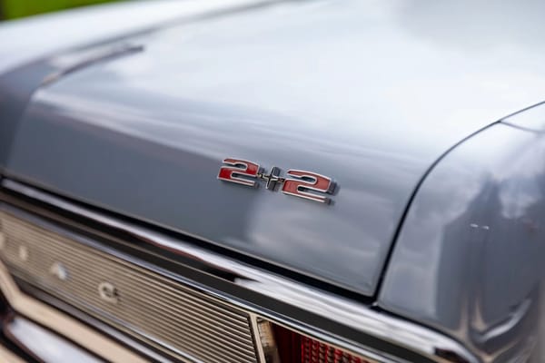 Vintage Car Life Review: 1965 Pontiac Catalina 2+2 421 HO – 2 Plus 2 Does Not Equal GTO 5 Red "2+2" badge on the rear decklid of a Fontaine Blue 1965 Pontiac Catalina 2+2