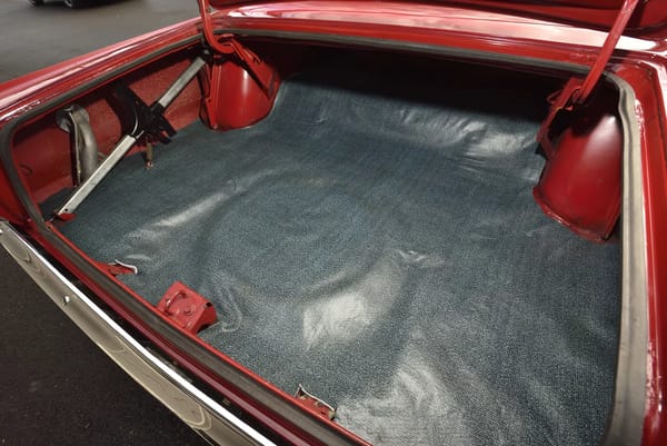 Trunk compartment of a Bright Red 1967 Plymouth GTX
