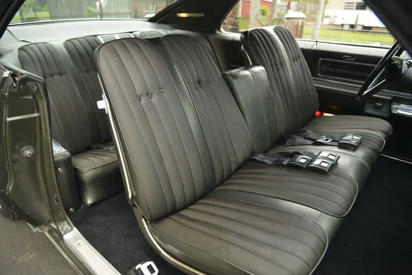 1968 Ford Thunderbird Versus Rivals – How Ford Ranked The T-Bird's Competition 25 Strato-Bench seat in a Jade Gold Metallic 1968 Oldsmobile Toronado with green cloth and vinyl upholstery, viewed through the passenger door