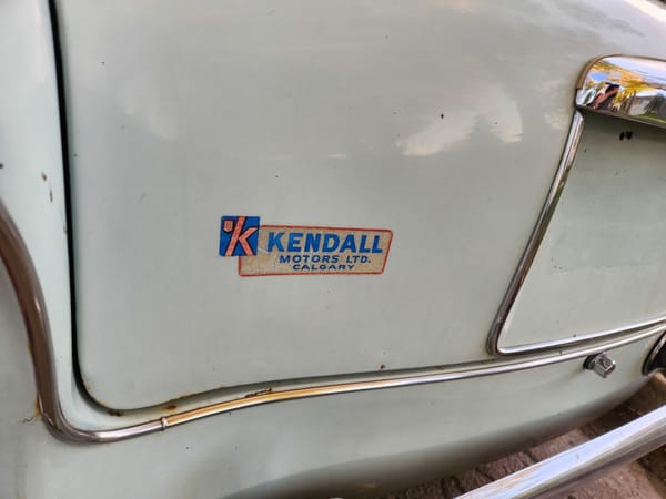 1961 Singer Gazelle dealer badge.