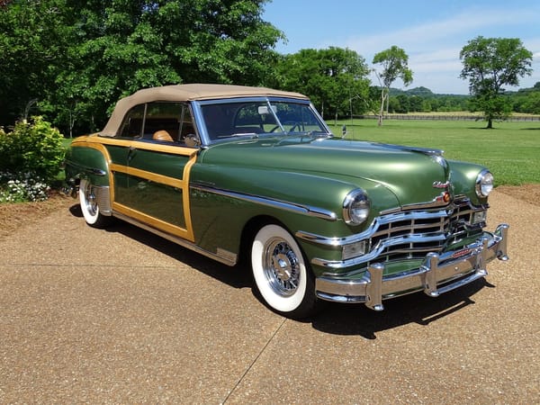 Two Dozen Green Cars And Trucks To Mark The Start of Spring 24 Front 3q view of a Noel Green 1949 Chrysler Town & Country woodie convertible with the top up