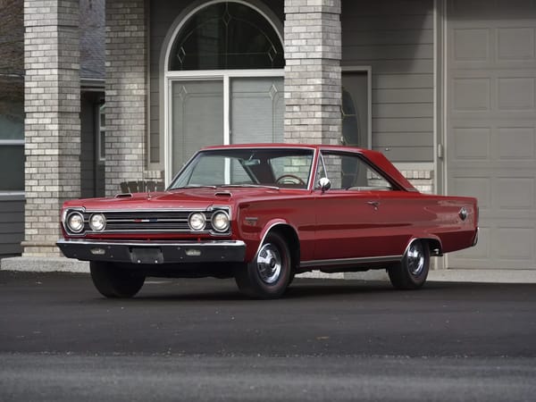 Left front 3q view of a Bright Red 1967 Plymouth GTX hardtop