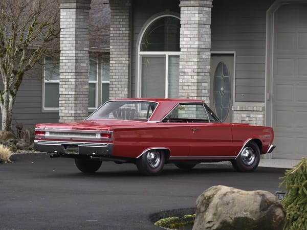 Right rear 3q view of a Bright Red 1967 Plymouth GTX hardtop
