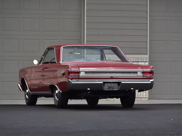 Rear view of a Bright Red 1967 Plymouth GTX hardtop