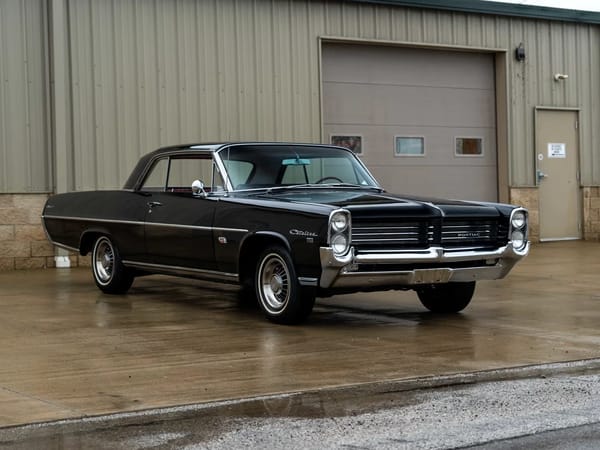 Vintage Car Life Review: 1965 Pontiac Catalina 2+2 421 HO – 2 Plus 2 Does Not Equal GTO 4 Right front 3q view of a black 1964 Pontiac Catalina 2+2 two-door hardtop