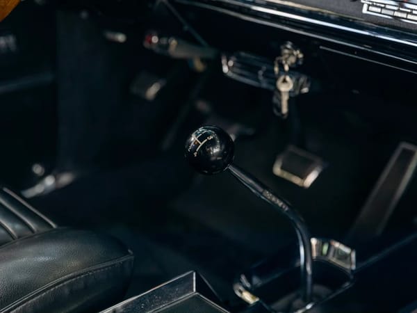 Vintage Car Life Review: 1965 Pontiac Catalina 2+2 421 HO – 2 Plus 2 Does Not Equal GTO 16 4-speed shifter in a 1965 Pontiac Catalina 2+2 with black interior