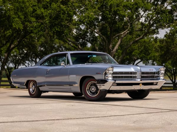 Vintage Car Life Review: 1965 Pontiac Catalina 2+2 421 HO – 2 Plus 2 Does Not Equal GTO 1 Right front 3q view of a Fontaine Blue 1965 Pontiac Catalina 2+2 two-door hardtop with 8-lug aluminum wheels and red-stripe tires