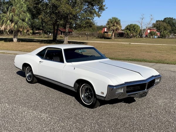 1968 Ford Thunderbird Versus Rivals – How Ford Ranked The T-Bird's Competition 4 Right front 3q view of an Arctic White 1968 Buick Riviera in a parking lot