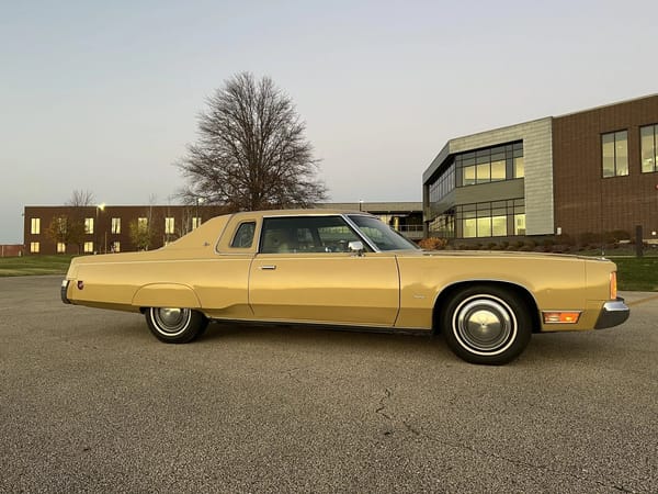 Right side view of a gold 1974 Imperial LeBaron Crown Coupe