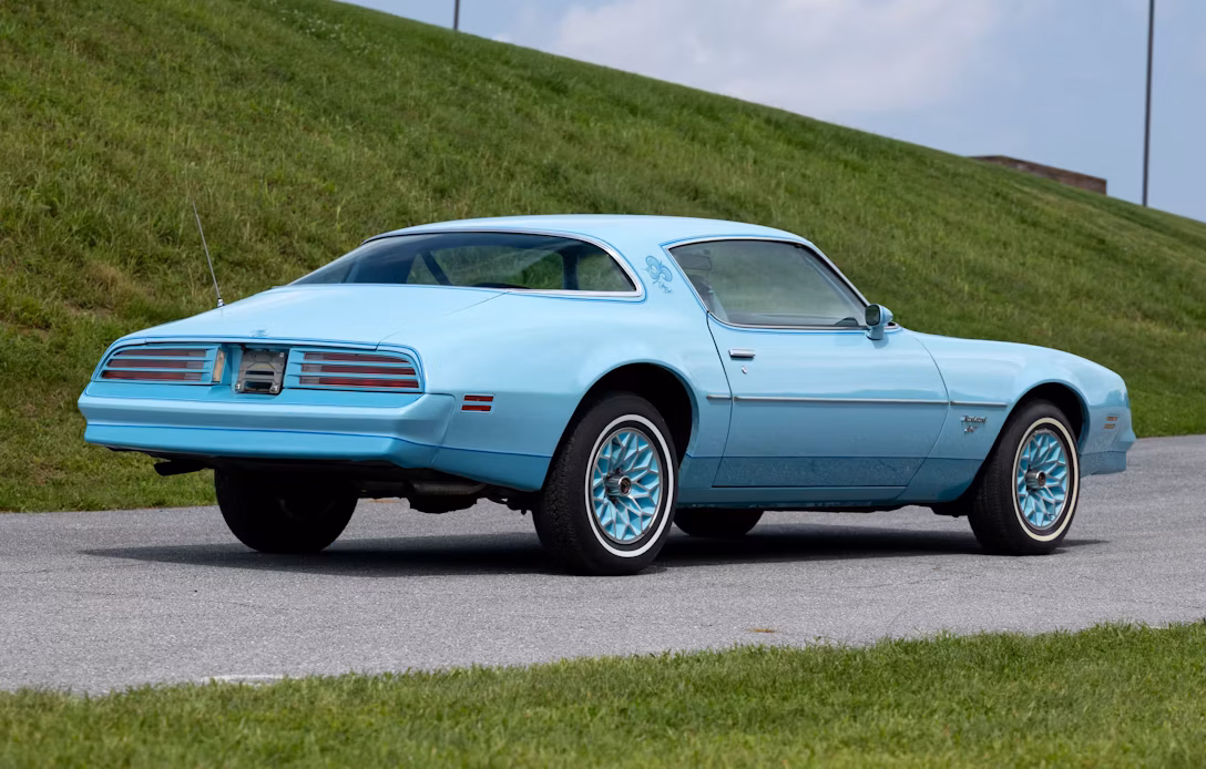 1978 Pontiac Firebird Esprit Sky Bird: A No-Reserve Chance To Own A Cosmetically Restored Museum Car 10 Passenger rear 3q picture of 1978 Pontiac Firebird Esprit Sky Bird in front of a grassy hill