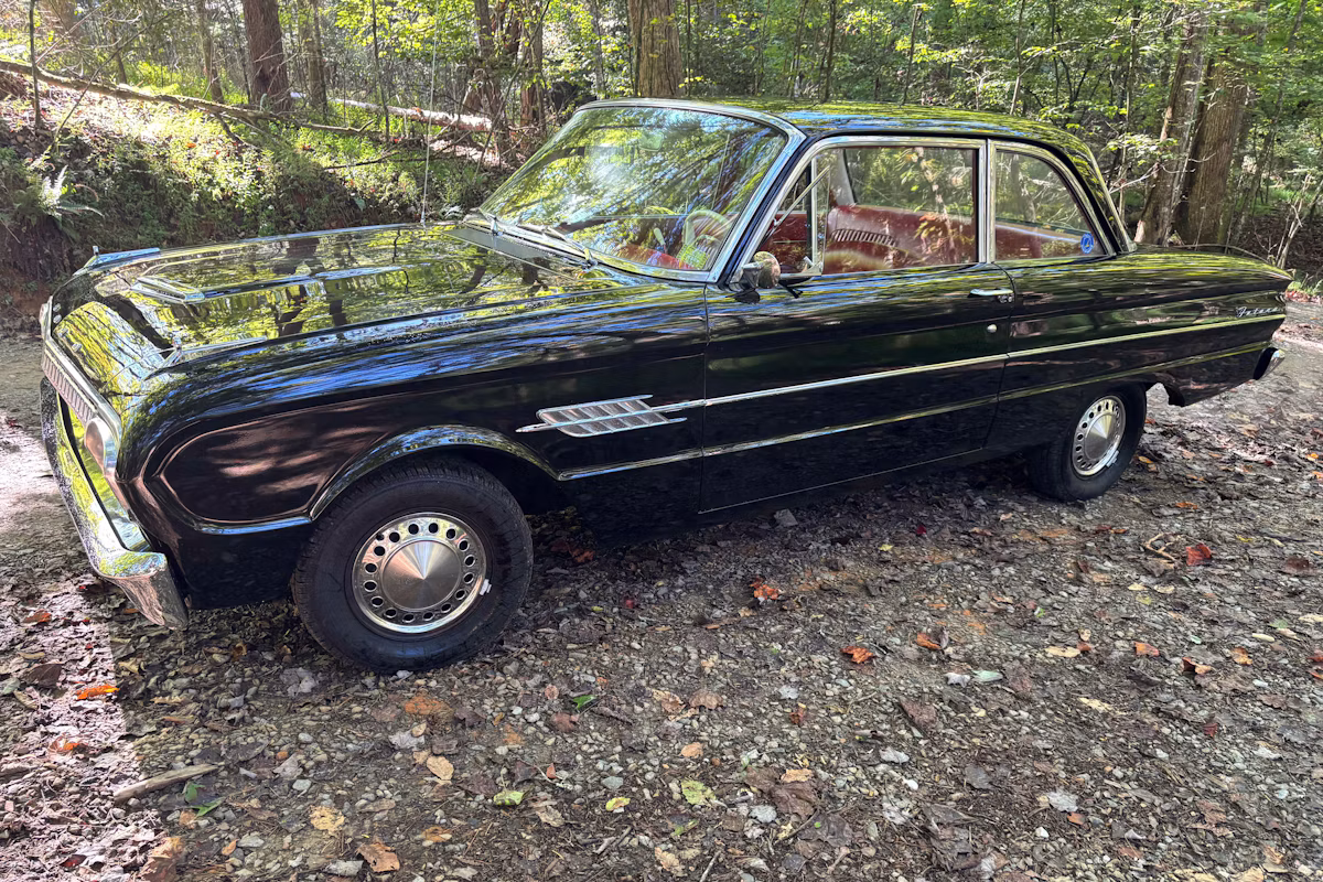 1962 Ford Falcon Futura: A Well-Documented, One-Option Falcon With A 144/Fordomatic 1 Driver front 3q picture of black 1962 Ford Falcon Futura in a wooded setting