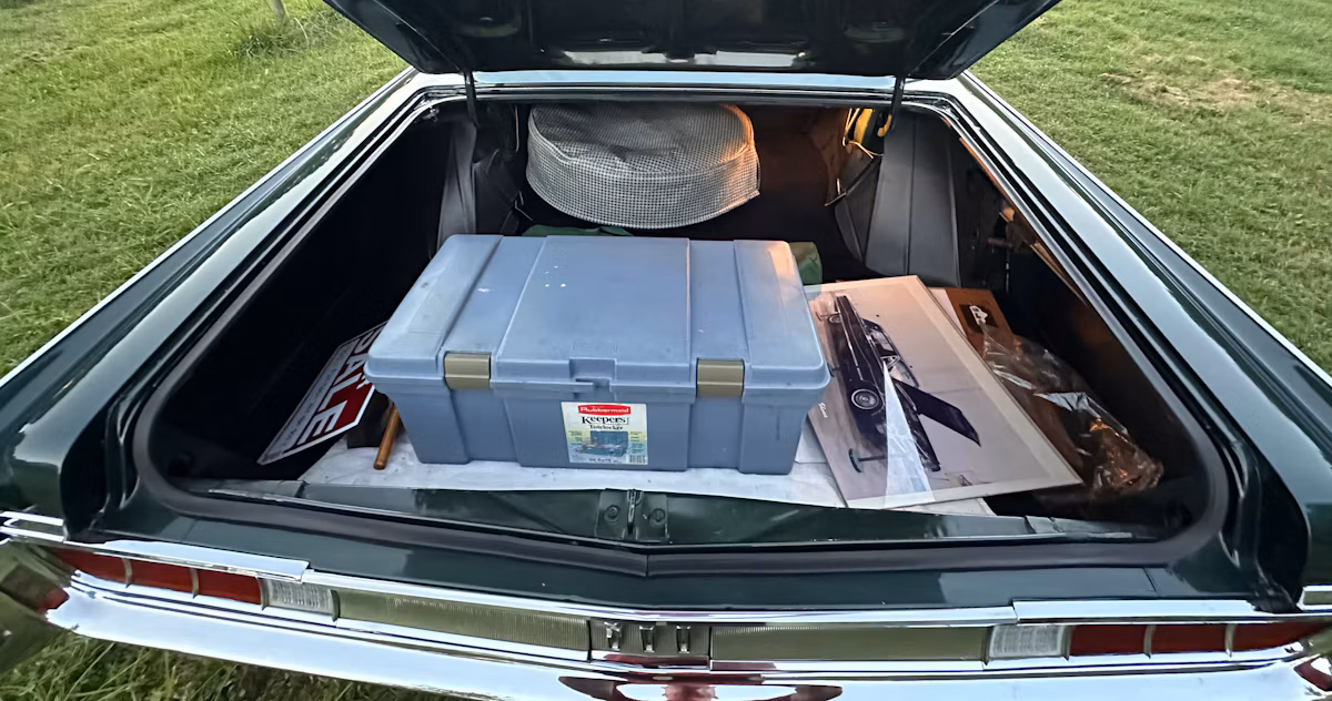 Luggage compartment of dark green 1965 Chrysler 300 